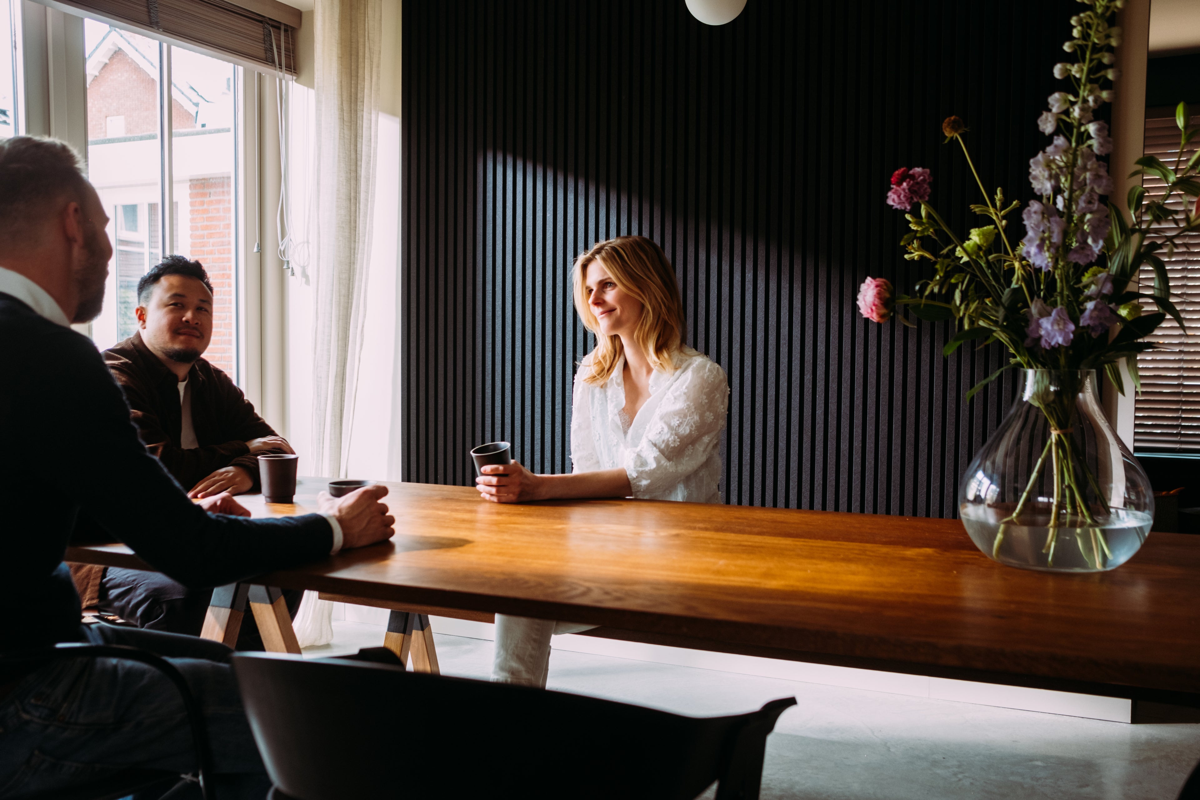 Woman sitting at table acoustic panels